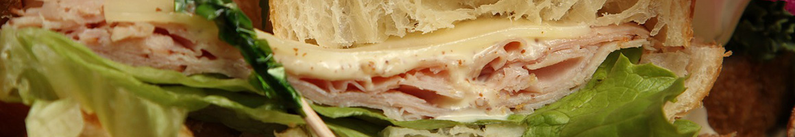 Eating Sandwich Bagels at Sam's Bagels restaurant in Brooklyn, NY.